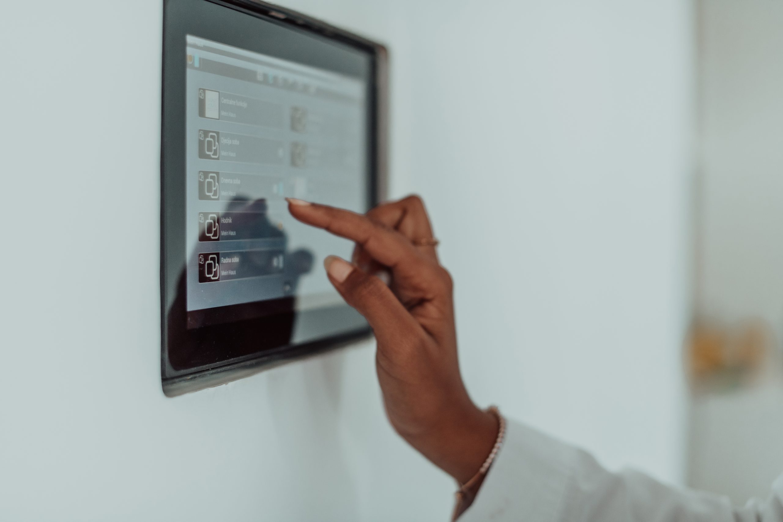 african woman using smart home screen control system photo